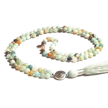 Handmade Hope Mala Necklace – Amazonite for Manifestation & Healing with Lotus guru bead curled on table